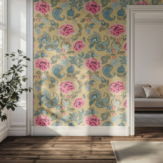 Pink floral and blue paisley pattern with yellow background wallpaper in a room with a couch and plant.