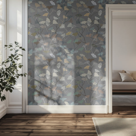 Room with a gray leaf decorative wall panel featuring leaf patterns and a couch in the background.