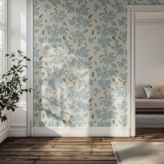 Hallway with a floral and polka dot wall pattern, plant, and sofa.