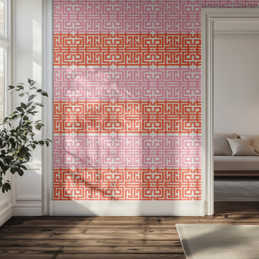 Hallway with pink and bright red geometric wallpaper pattern in natural light.
