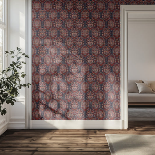 Maroon and red patterned wallpaper in a room with a couch and a plant.