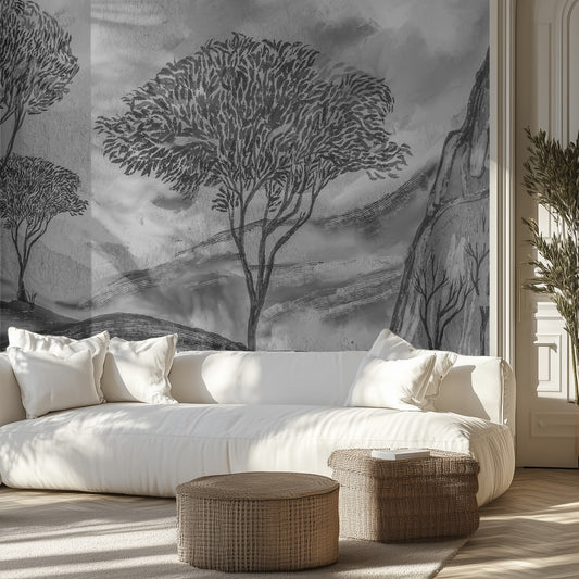 Living room with a large wall mural of trees and mountains, white sofa, and wicker ottomans.