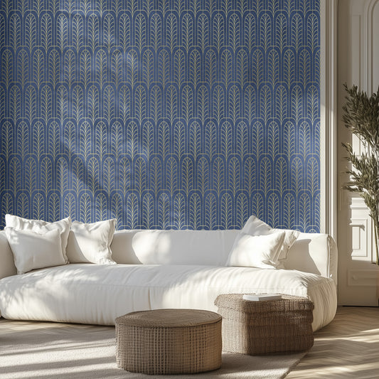 Living room with white sofa, art deco arch patterned blue wall, and wicker ottomans.