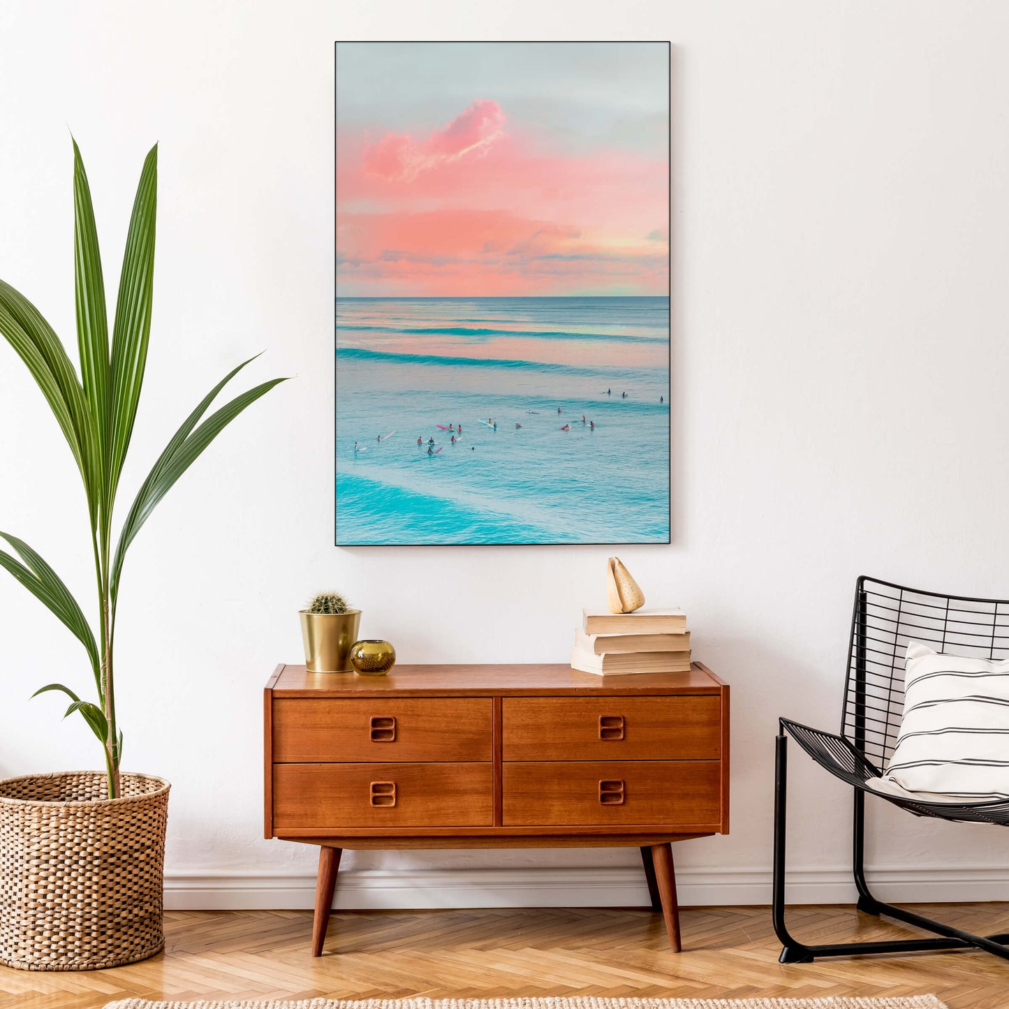 Large Surf landscape in aqua and coral hangs in a minimalistic entryway
