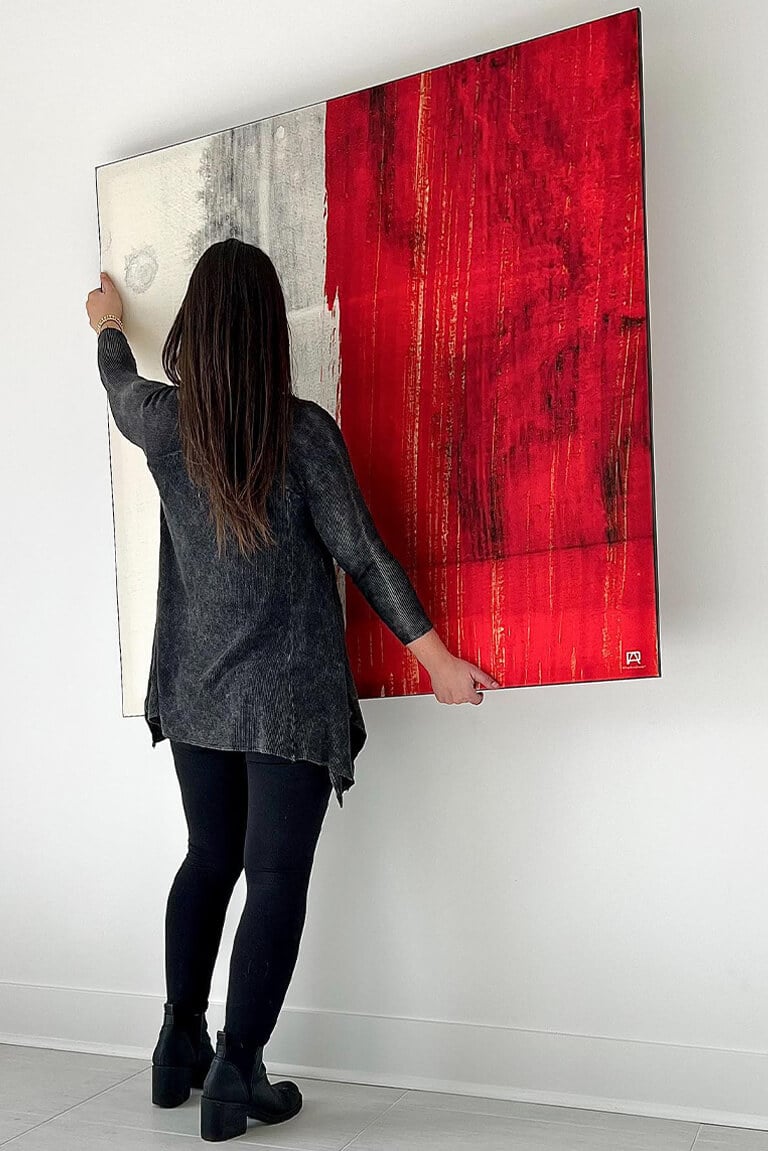 Large Red Abstract Wall Art Being Hung on White Wall