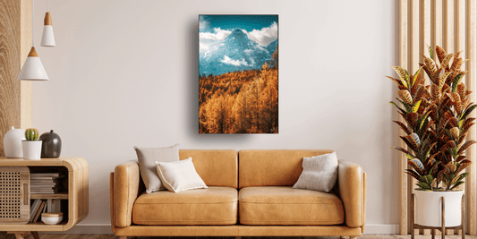 living room with fall wall art hanging over a yellow couch