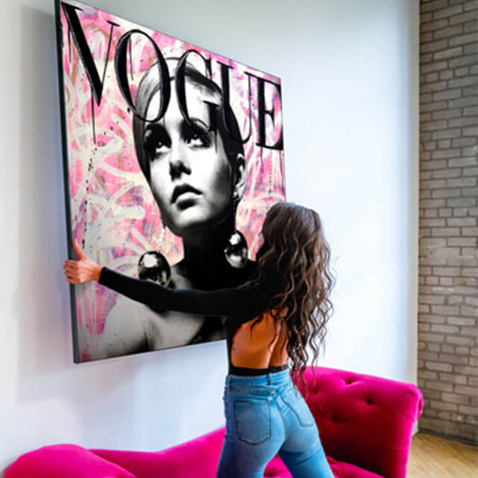 Girl on pink couch hanging Large Pink Twiggy Vogue addition print with pink background. 