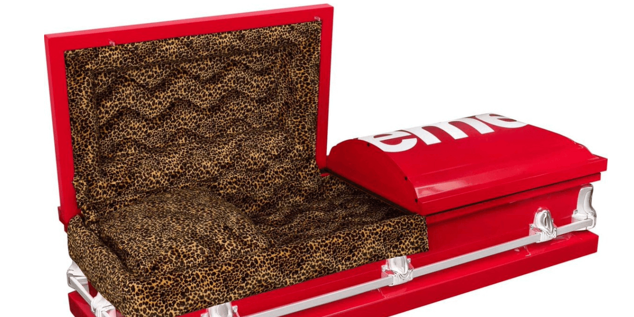 red supreme branded casket with leopard print interior