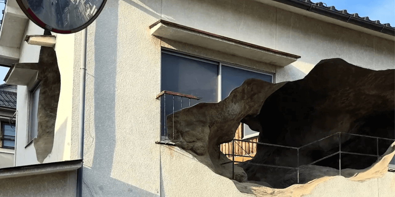 external view of home turned into a cavern with a large open hole visible from outside