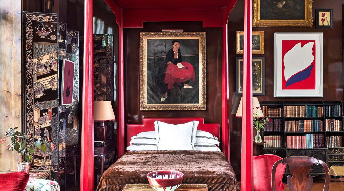 maximalist bedroom with red accents organized in a "cluttercore" fashion.