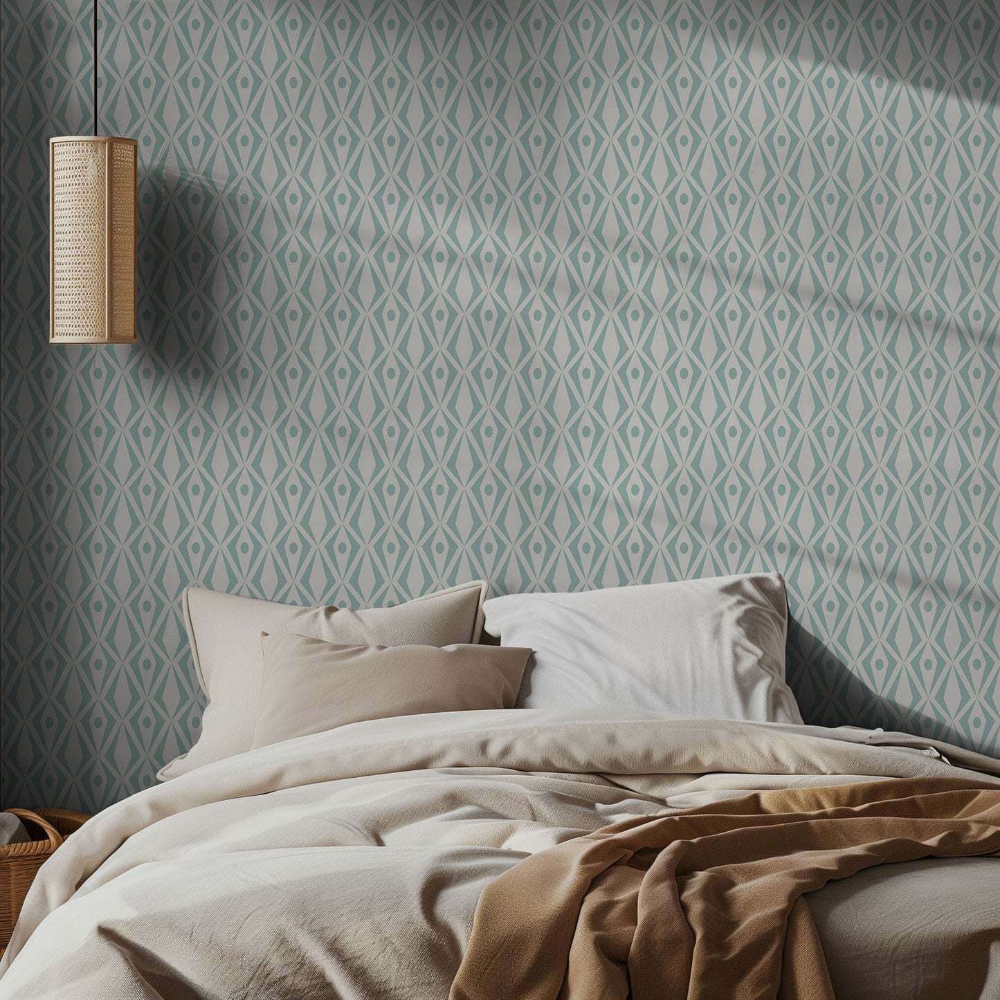 Bedroom with aqua and white geometric patterned wallpaper and soft lighting.