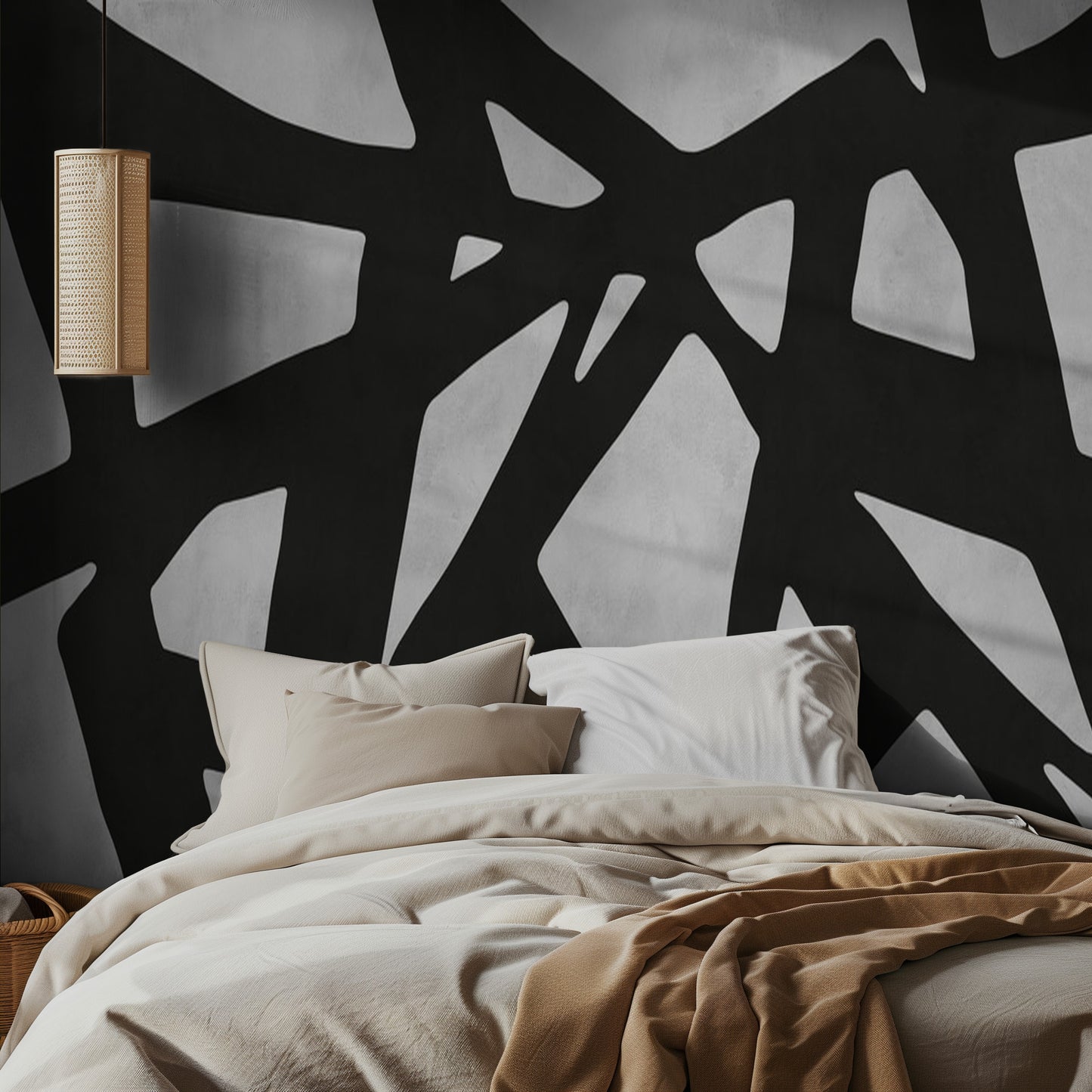 Bedroom with abstract black and white stroke wall mural and beige bedding.