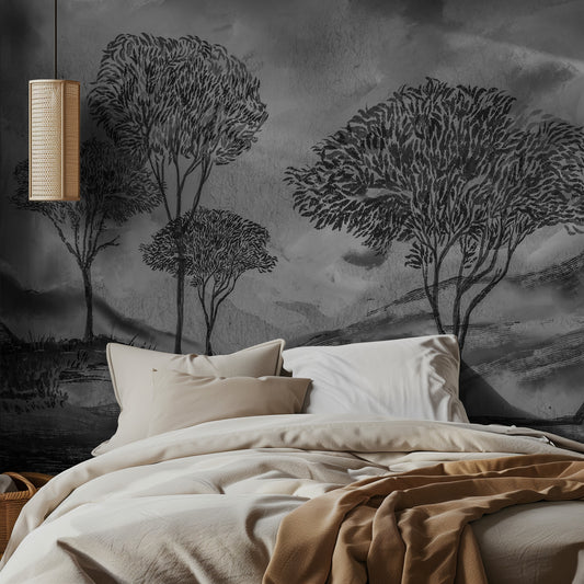 Bedroom with monochrome tree mural on the wall and soft lighting.