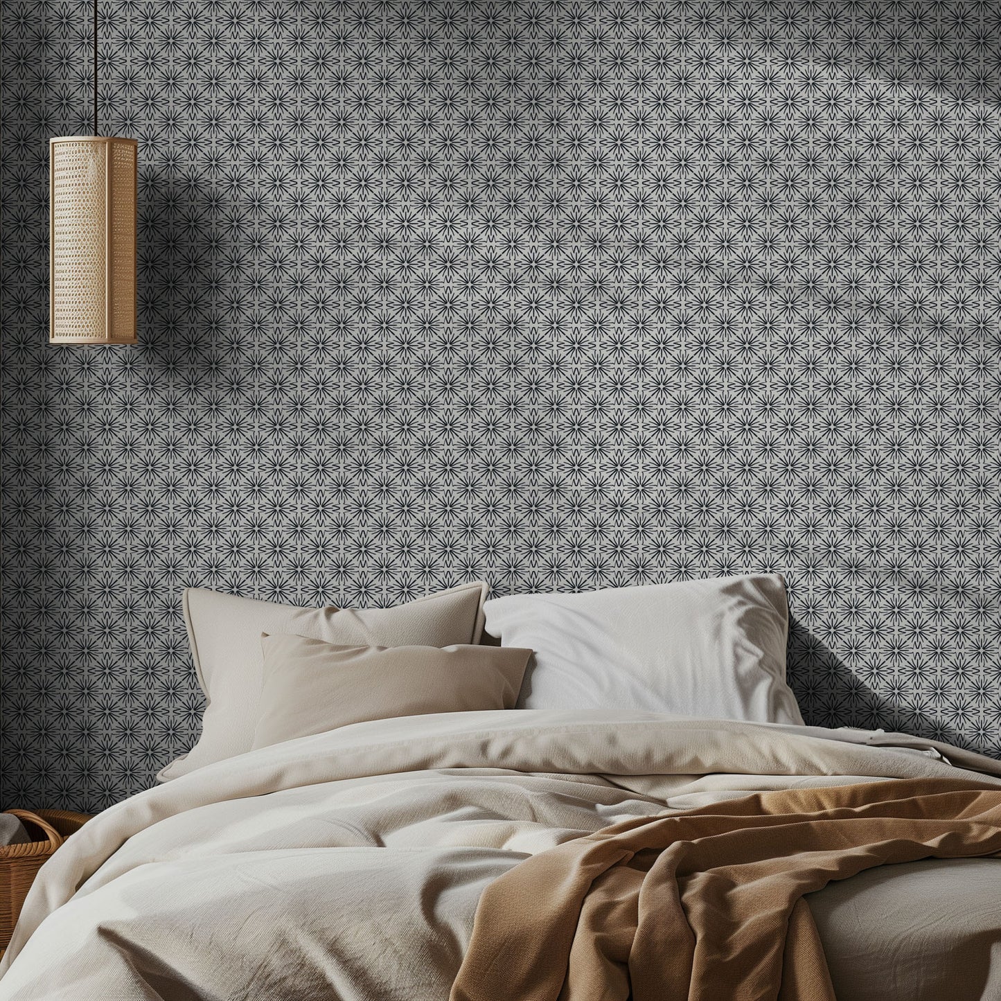 Bedroom with black and white geometric patterned wallpaper and neutral bedding