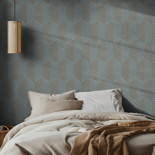 Bedroom with gray and teal, geometric cubed patterned wallpaper and neutral bed.