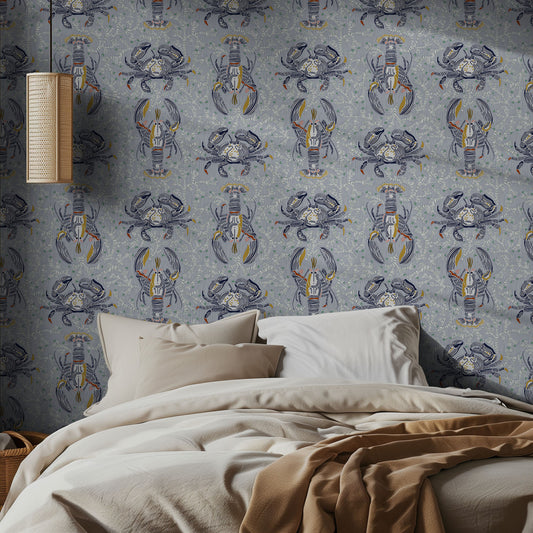 Bedroom with illustrated lobster and crab patterned wallpaper and beige bedding.