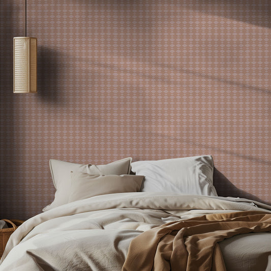 Bedroom with pink boho diamond patterned wallpaper and soft lighting with neutral bed.