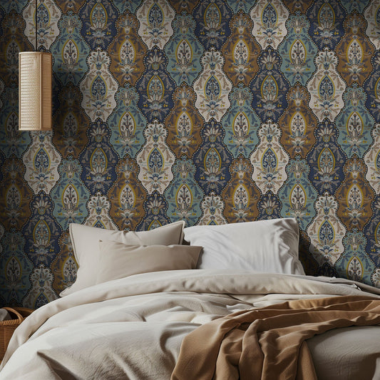 Bedroom with ornate teal and tan boho patterned wallpaper and soft bedding