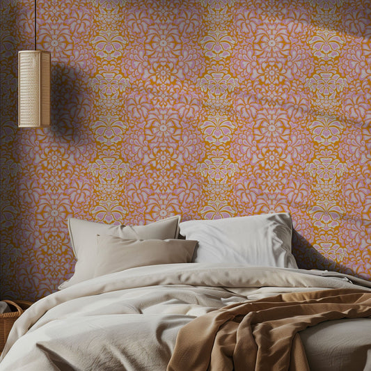 Bedroom with vibrant pink and orange floral patterned wallpaper and soft bedding