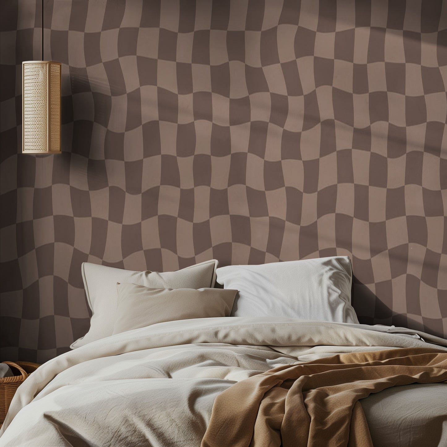 Bedroom with a brown checkered wall pattern and soft bedding.