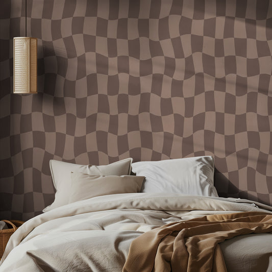 Bedroom with a brown checkered wall pattern and soft bedding.