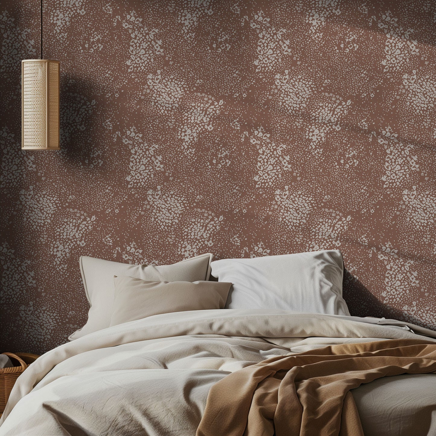 Bedroom with brown and white animal print wallpaper and soft bedding