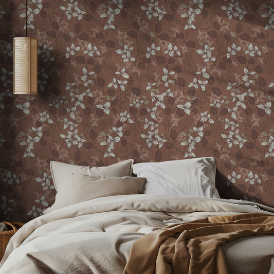 Bedroom with white and brown floral wallpaper and beige bedding