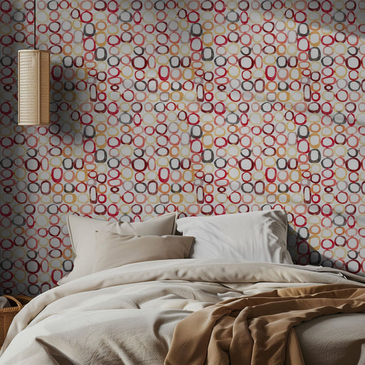 Bedroom with a bed and colorful circular watercolor patterned wall.