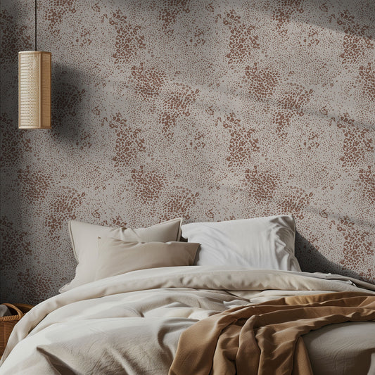 Bedroom with animal print patterned wallpaper and soft bedding