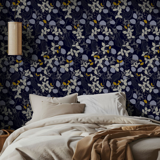 Bedroom with navy floral wallpaper and beige bedding