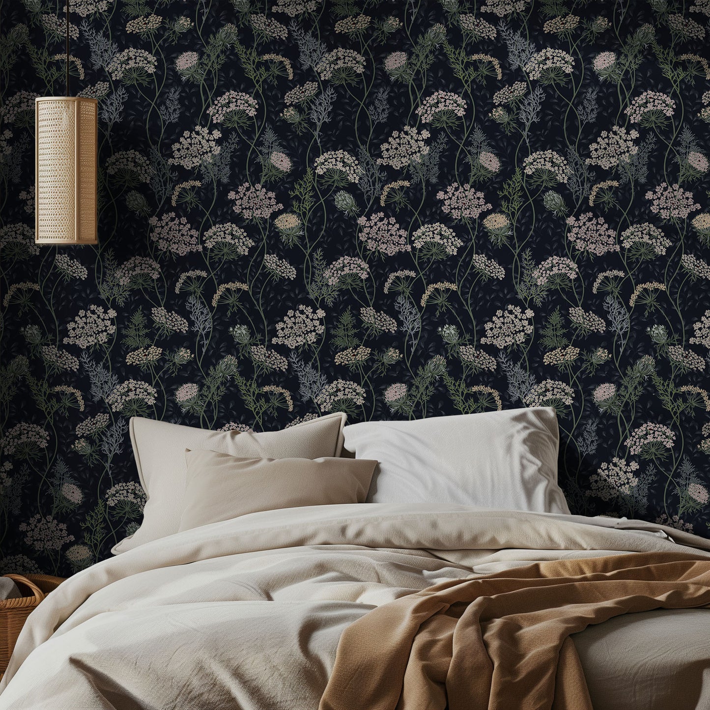 Bedroom with dark navy floral wallpaper and beige bedding
