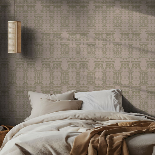 Bedroom with pink beige, boho patterned wallpaper and soft bedding.