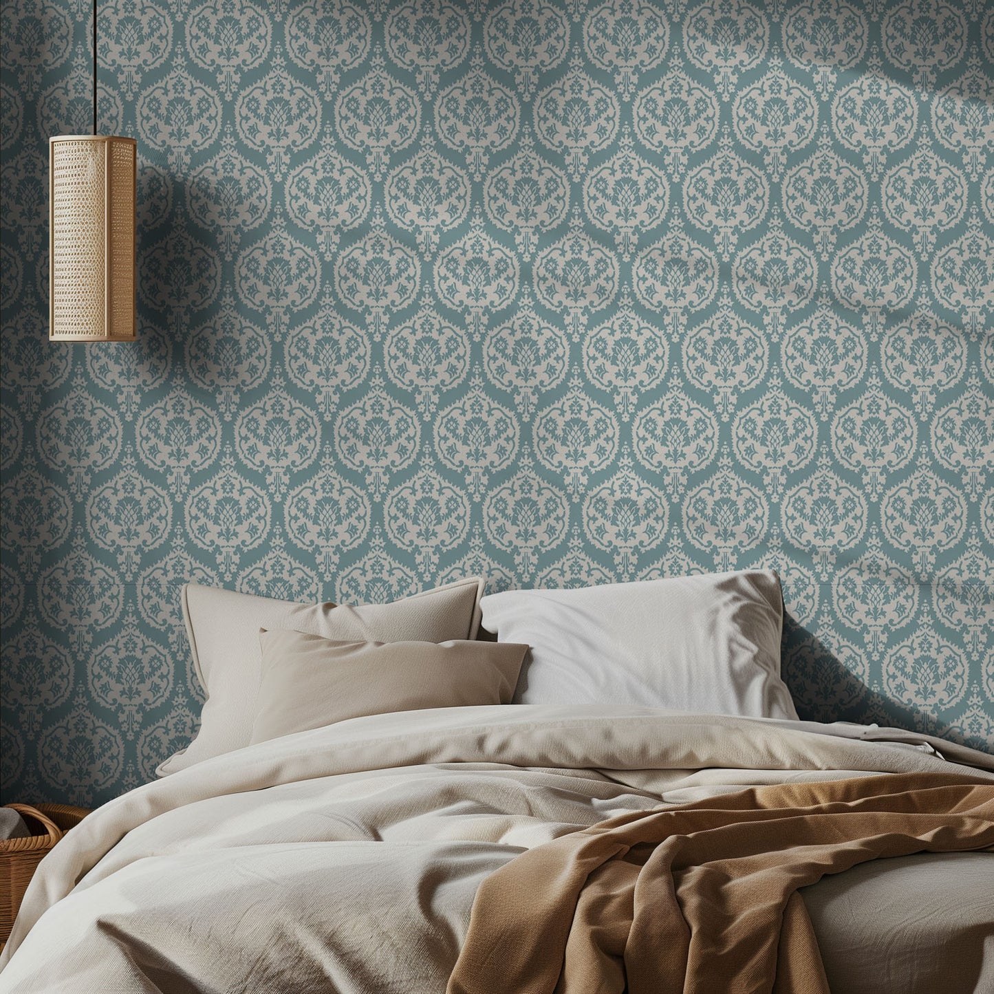 Bedroom with teal and white damask wallpaper patterned walls with neutral bedding.