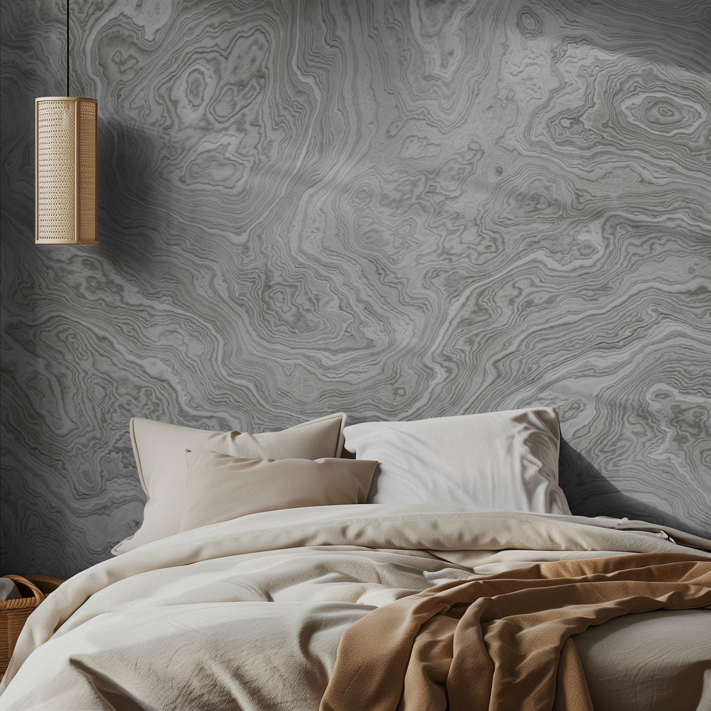 Bedroom with light marble-patterned wallpaper and a hanging light fixture.