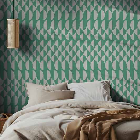 Bedroom with green geometric wallpaper and beige bedding