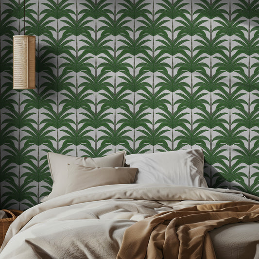 Bedroom with green palm patterned wallpaper.