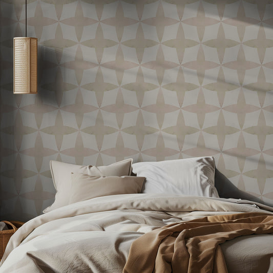 Bedroom with light neutral diamond patterned wallpaper and neutral bedding.