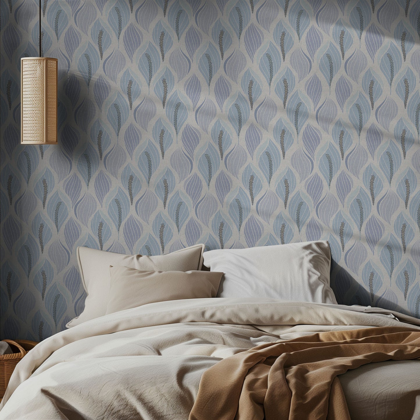 Bedroom with pale blue lily patterned wallpaper and soft bedding