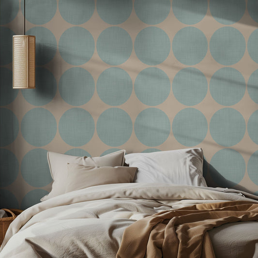 Bedroom with oversized, light blue, polka dot wall pattern and neutral bedding.