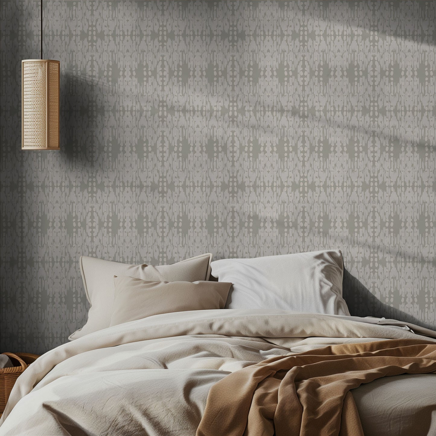 Bedroom with ikat boho sage green and white patterned wallpaper and soft bedding