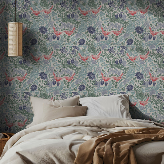 Bedroom with bird and floral wallpaper featuring birds and leaves, with a bed and lamp in the foreground.
