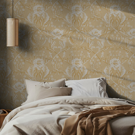 Bedroom with oversized white and yellow floral patterned wallpaper and soft bedding