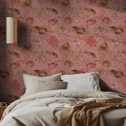 Bedroom with pink wallpaper featuring sea animal patterns and a lamp.