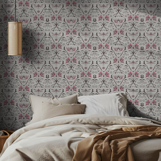 Bedroom with pink and white floral patterned wallpaper and a bed with beige bedding.