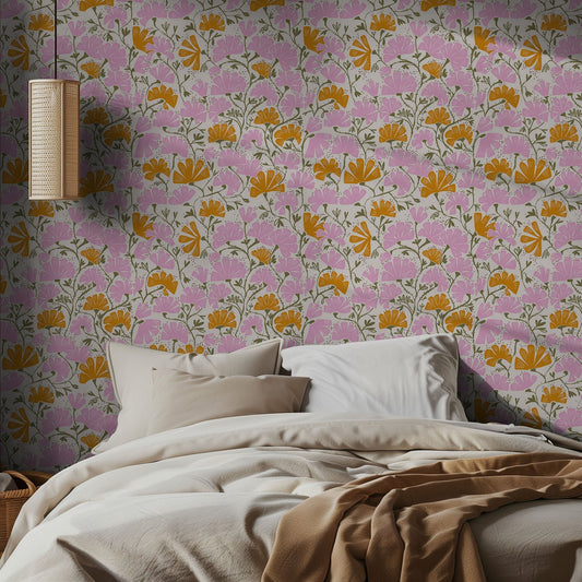 Bedroom with floral wallpaper featuring pink and orange flowers, and a lamp on the wall.