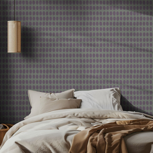 Bedroom with purple polka dot on sage background wallpaper and beige bedding