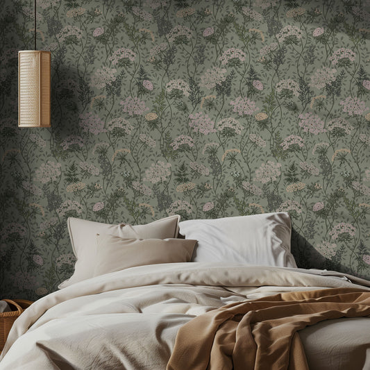 Bedroom with sage and pink floral wallpaper and soft bedding