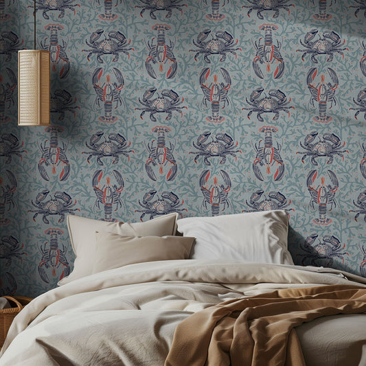 Bedroom with lobster and crab patterned wallpaper and beige bedding.