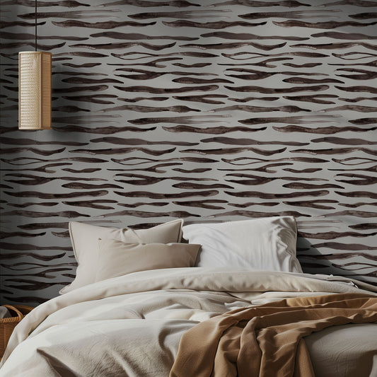 Bedroom with wavy patterned wallpaper and neutral bedding.