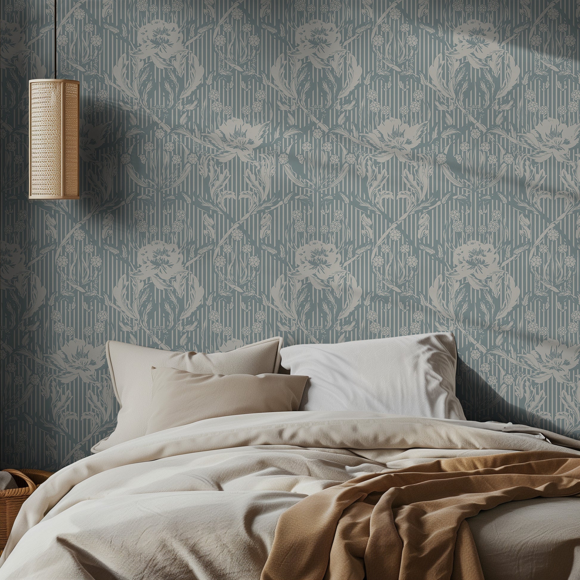Bedroom with light teal floral patterned wallpaper and soft bedding